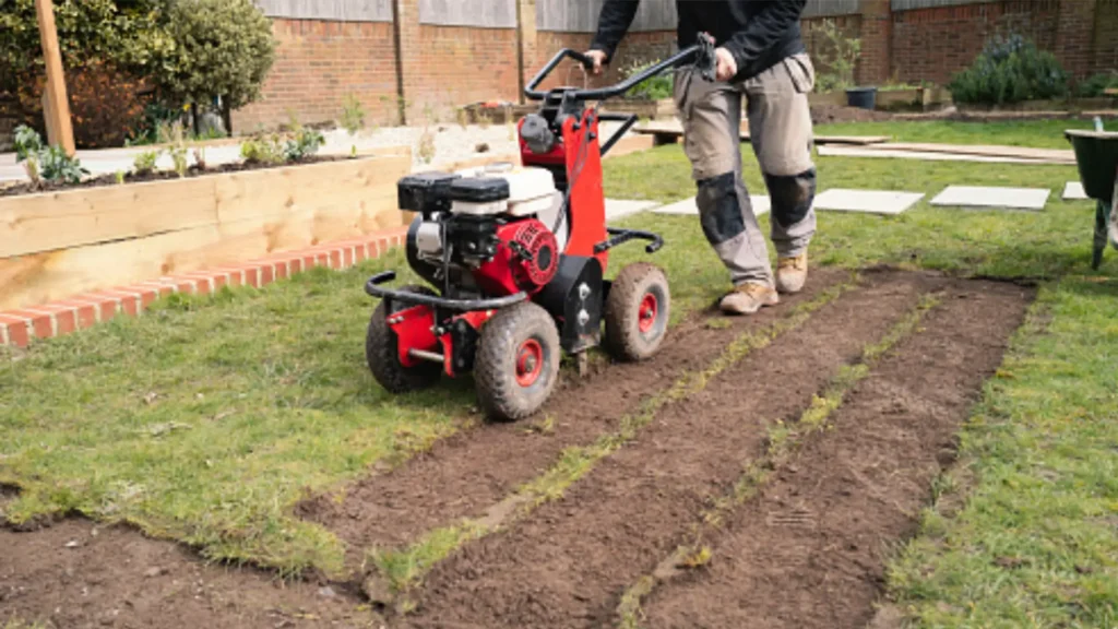 Professional ground preparation using machinery to ensure a level base for a OneGrass synthetic turf installation
