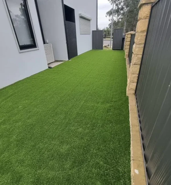 OneGrass synthetic turf provides a lush, low-maintenance lawn for a residential backyard