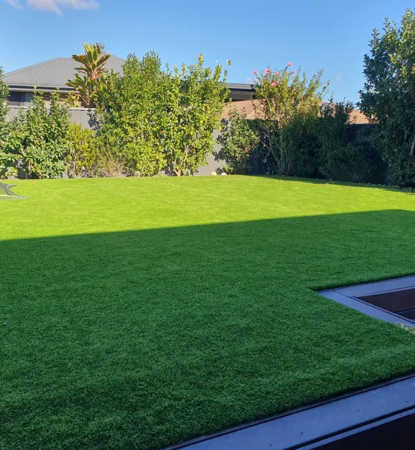 OneGrass synthetic turf creates a vibrant, level backyard lawn