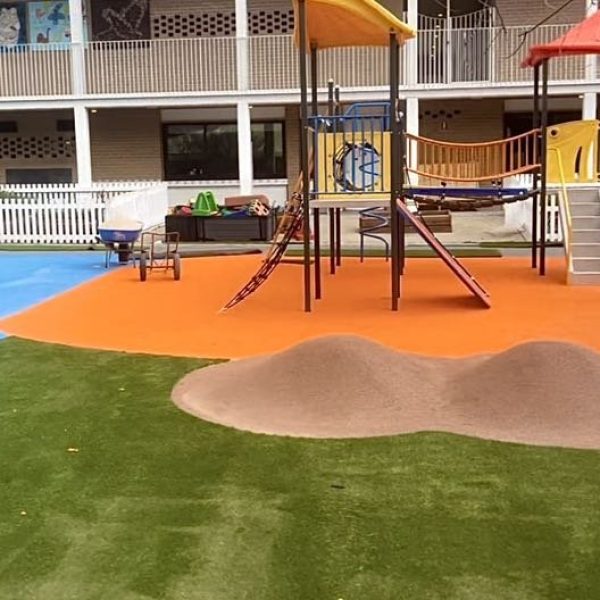 OneGrass synthetic turf installed in the playground featuring modern play equipment